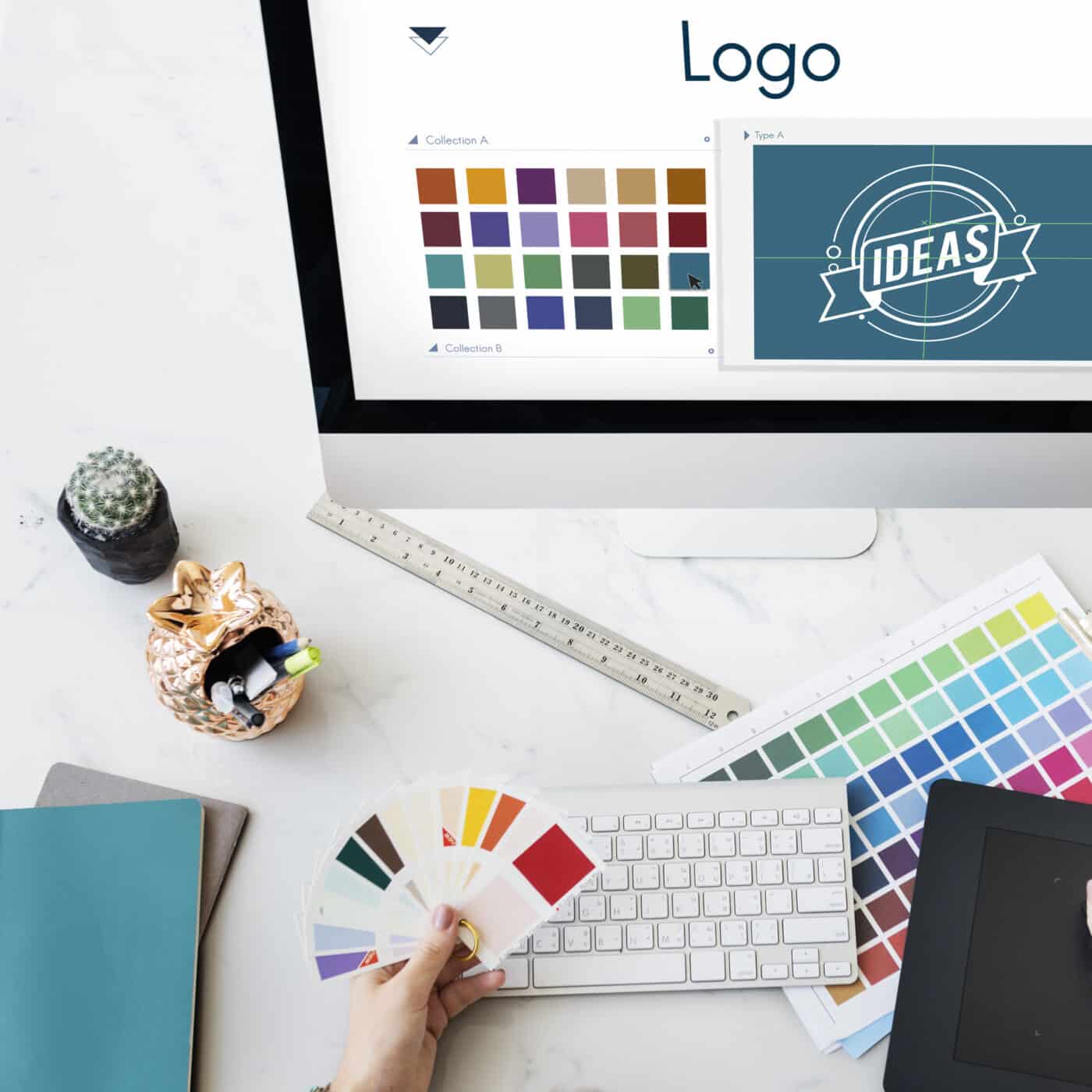 Création de logo pour entreprise avec choix des couleurs, palette graphique et conception d'identité visuelle sur ordinateur.